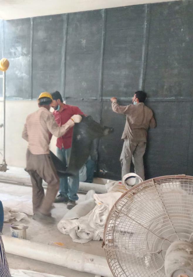 Rubber Tech Plus technicians installing rubber lining inside an industrial vessel