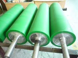 Green rubber-covered industrial rollers with steel shafts