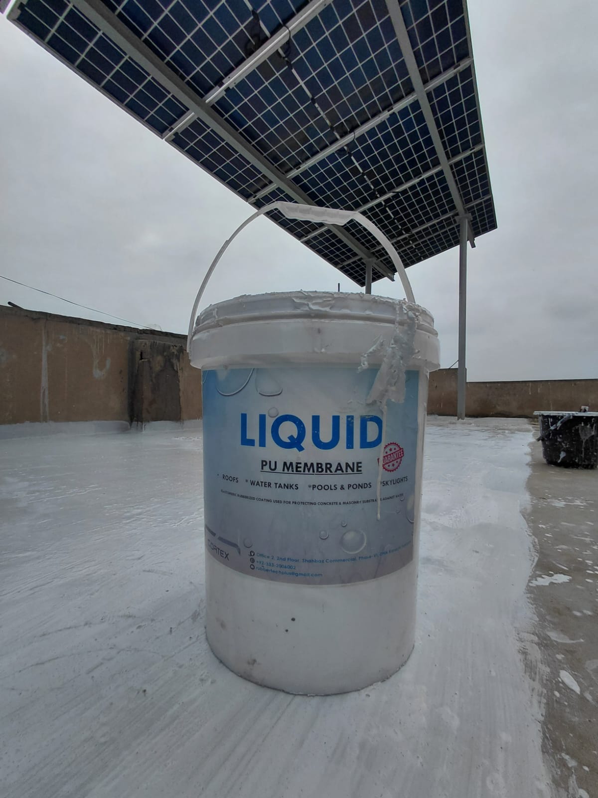 Liquid PU Membrane waterproofing bucket on a treated rooftop