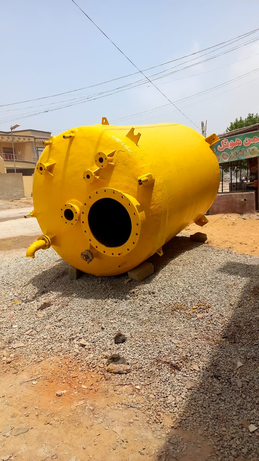 Completed yellow fiber-lined process vessel with multiple nozzles