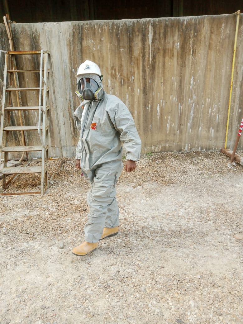 Industrial lining technician wearing full protective equipment