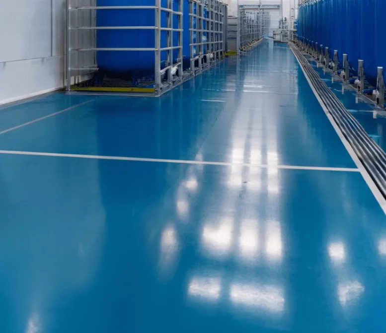 Blue epoxy flooring in an industrial process area