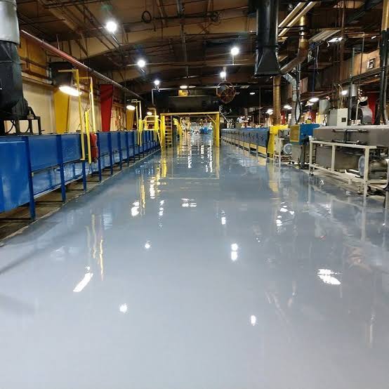Grey epoxy flooring in a heavy industrial production area